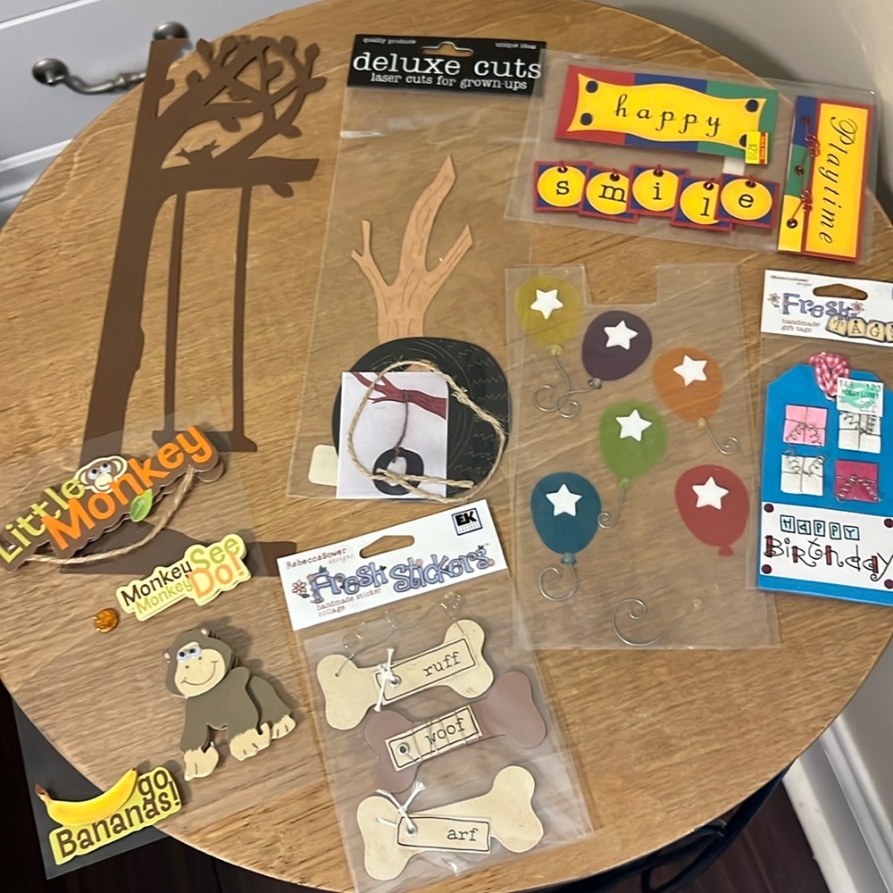 Assortment of scrapbook and card making stickers, die cuts and tags